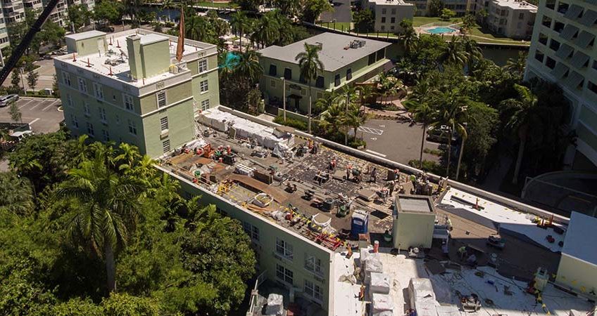 commercial-roof-life-cycle-management-and-budgeting-tips-florida-848×450 Rooftop construction in progress in Fort Myers