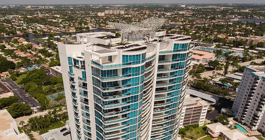 Aquazul a modern high-rise building with curved glass balconies
