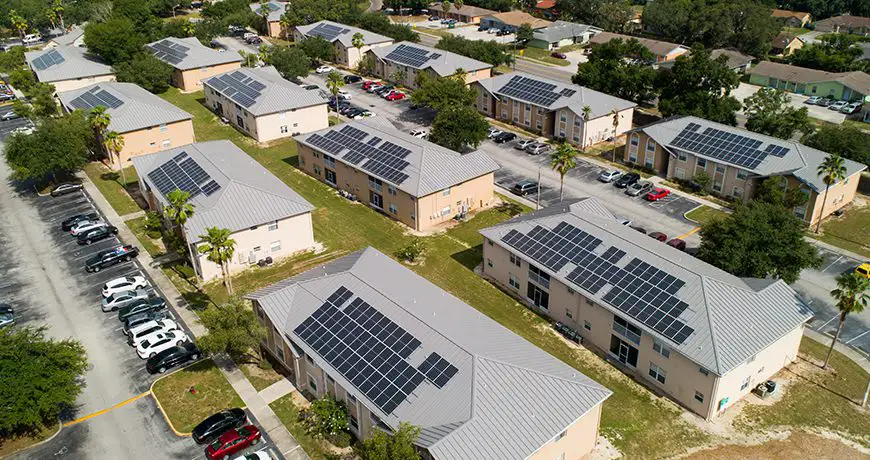 buildings with solar panels on metal roofs in Miami