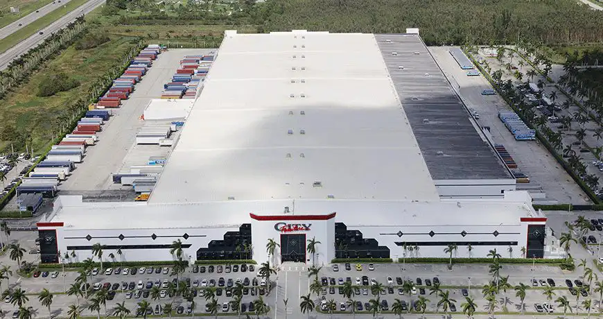 Large warehouse facility with a white roof in florida