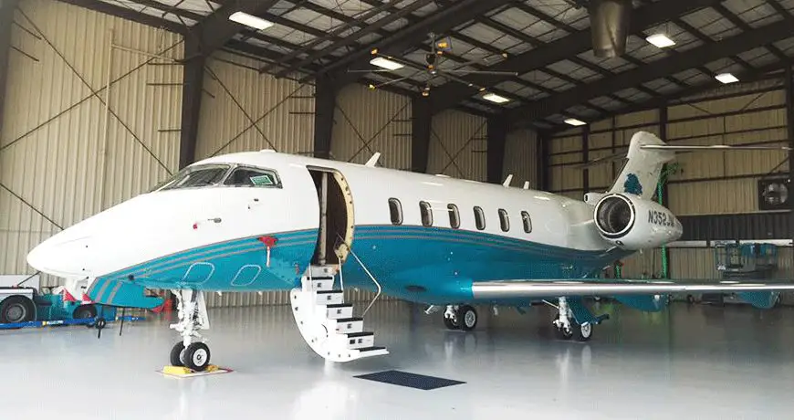 JM-Family-Aviation Private jet parked inside a spacious aircraft hangar
