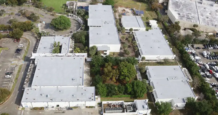 MCNAB-Elementary-School multiple low-rise commercial buildings with flat white roofs in Palm Beach