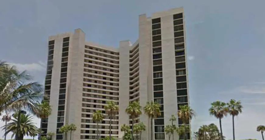 Ocean-Towers-Condo High-rise building with palm trees