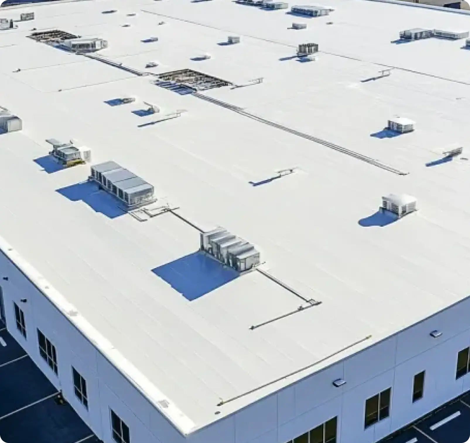 Commercial roof coating in Miami being applied to a low-slope membrane