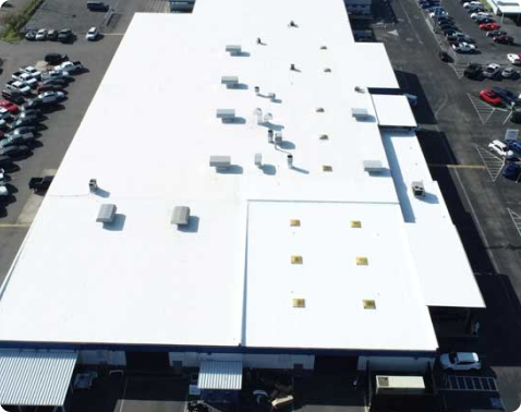 Advanced Roofing technician repairing membrane flashing on a Miami commercial roof