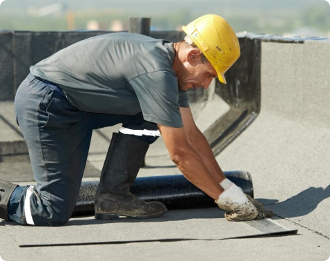 Advanced Roofing technician repairing membrane flashing on a Miami commercial roof
